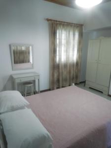 Postel nebo postele na pokoji v ubytování Marketos Apartments