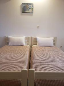Postel nebo postele na pokoji v ubytování Marketos Apartments
