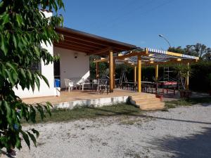 a house with a deck with a table and chairs at B&B Arcafelice in Termoli