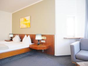 Postel nebo postele na pokoji v ubytování Stadthaus Valentin