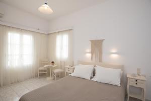 Postel nebo postele na pokoji v ubytování Hotel Charissi