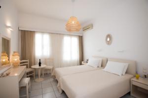 Postel nebo postele na pokoji v ubytování Hotel Charissi