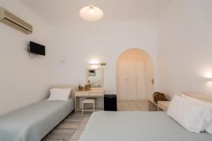 Postel nebo postele na pokoji v ubytování Hotel Charissi