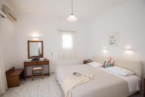 Postel nebo postele na pokoji v ubytování Hotel Charissi