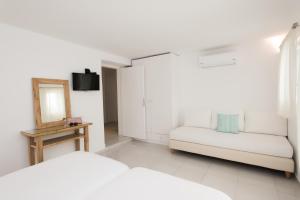 Postel nebo postele na pokoji v ubytování Hotel Charissi
