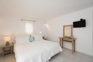 Postel nebo postele na pokoji v ubytování Hotel Charissi