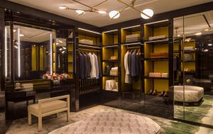 a dressing room with a lot of shelves at Four Seasons Hotel London at Ten Trinity Square in London