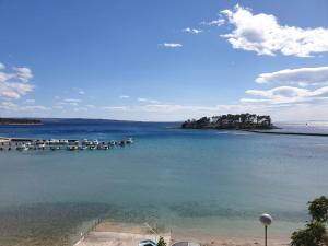 a view of a body of water with boats in it at Banjol 441 Apartman mare in Rab