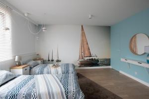 Postel nebo postele na pokoji v ubytování Apartament Zefir Mechelinki