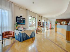 TV a/nebo společenská místnost v ubytování Hotel Cristina