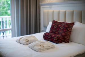 Postel nebo postele na pokoji v ubytování Hotel Passport Tbilisi