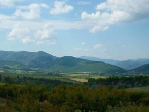 a view of a valley with mountains in the distance at Holiday Home Du Brun by Interhome in Bésignan