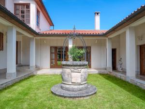 a large stone fountain in the yard of a house at Holiday Home Lupetina by Interhome in Hreljići