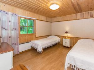 Postel nebo postele na pokoji v ubytování Holiday Home Ikonen by Interhome