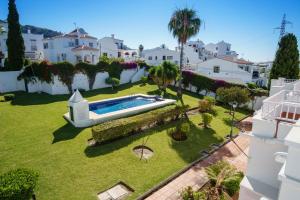 an aerial view of a yard with a swimming pool at Villa Angie in Nerja