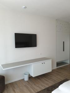 TV a/nebo společenská místnost v ubytování Hotel Jasmin