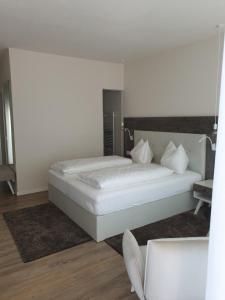 Postel nebo postele na pokoji v ubytování Hotel Jasmin