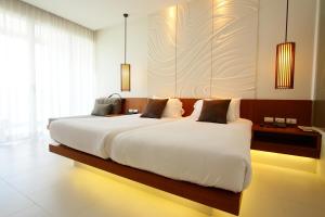 Postel nebo postele na pokoji v ubytování G Hua Hin Resort & Mall