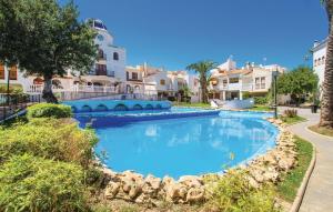 a large swimming pool in front of a building at Looking For Paradise in Gran Alacant