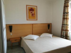 Кровать или кровати в номере Flag Hotel Foya Branca