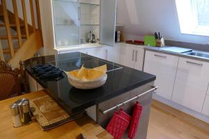a kitchen with a counter with a bowl on it at Ferienwohnung am Wulfkamp in Velen +13 photos
