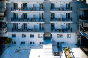 an aerial view of a tall building with balconies at 31 Doors Hotel in Alexandroupoli