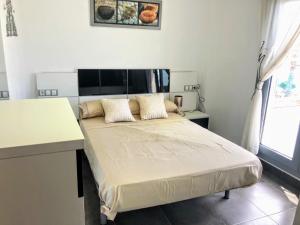 A bed or beds in a room at APARTAMENTO JMHR 5