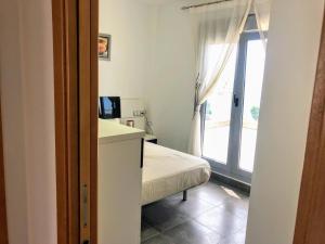 A bed or beds in a room at APARTAMENTO JMHR 5