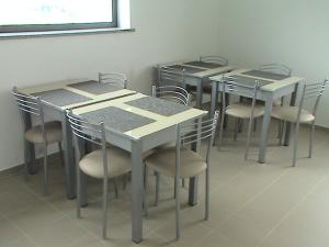 a group of tables and chairs in a room at RM newhost 2015 / CasaDoChico in Portalegre