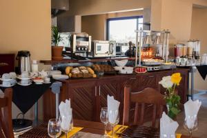 a kitchen with a counter with food on it at Callies Game Lodge Safaris in Tsumeb