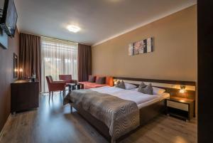 A bed or beds in a room at Apartmán Bešeňová