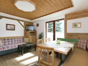 a living room with a table and a couch at Haus Helene Prantl in Längenfeld