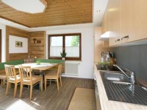 a kitchen and dining room with a table and chairs at Haus Helene Prantl in Längenfeld