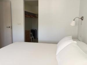 Łóżko lub łóżka w pokoju w obiekcie Casa Luz