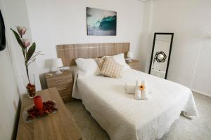 เตียงในห้องที่ Apartamento en Sevilla Capital