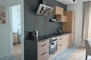 Kuchyňa alebo kuchynka v ubytovaní Apartament Grochowa