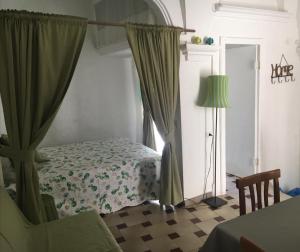 En eller flere senge i et værelse på Casa La Chicca di Gina