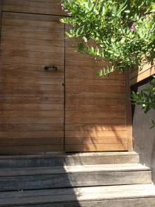 a wooden door with stairs leading up to it at Villa Bali in Cassis