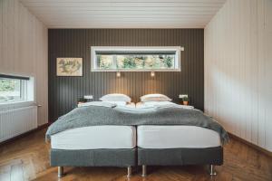 Ekra Glacier Lagoon客房内的一张或多张床位