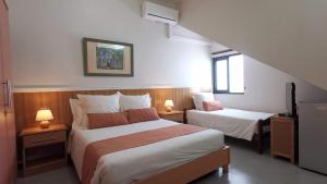 Кровать или кровати в номере Blue Beryl Guest House