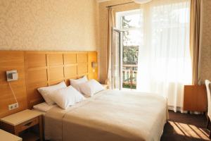 En eller flere senge i et værelse på Hotel Vila Diemedis