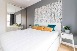 Posteľ alebo postele v izbe v ubytovaní Apartament DREAM Angielska Grobla