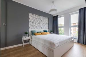 Posteľ alebo postele v izbe v ubytovaní Apartament DREAM Angielska Grobla