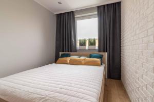 Posteľ alebo postele v izbe v ubytovaní Apartament DREAM Angielska Grobla