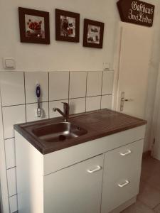 a kitchen counter with a sink in a room at Ferienhaus am Rennsteig in Schmiedefeld am Rennsteig
