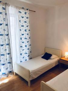 Posteľ alebo postele v izbe v ubytovaní Apartment Chupa