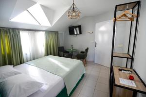 Postel nebo postele na pokoji v ubytování Hotel Niku