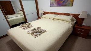 Cama o camas de una habitación en MarLenghi Apartments 3B