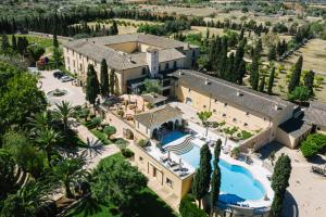an aerial view of a house with a swimming pool at Son Julia Country House & Spa in Llucmajor
