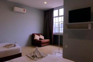 TV a/nebo společenská místnost v ubytování The b'Hotel